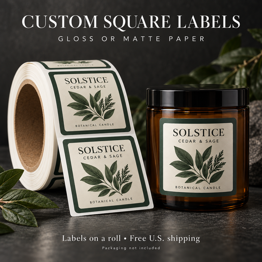 Custom square paper labels on a roll beside an amber candle — illustrative mockup